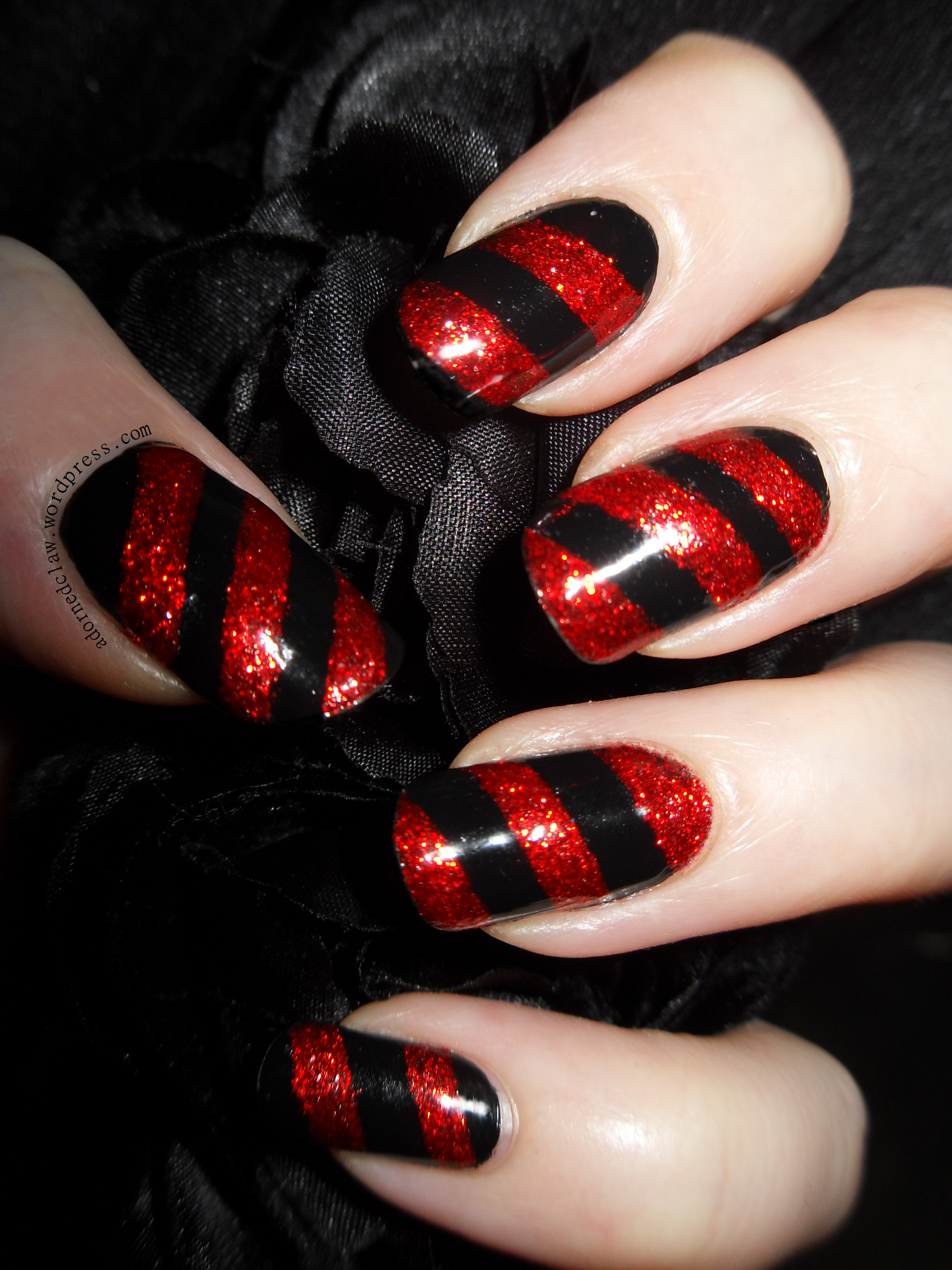 https://adornedclaw.com/wp-content/uploads/2013/12/bah-humbug-red-and-black-christmas-candy-cane-glitter-stripe-nail-art-barry-m-revlon.jpg?utm_source=chatgpt.com